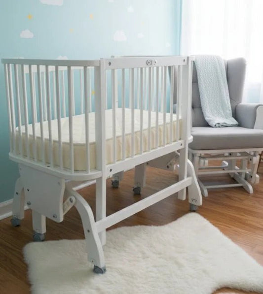 White Wooden Baby Gliding Crib | Modern & Soothing - althahanifurniture
